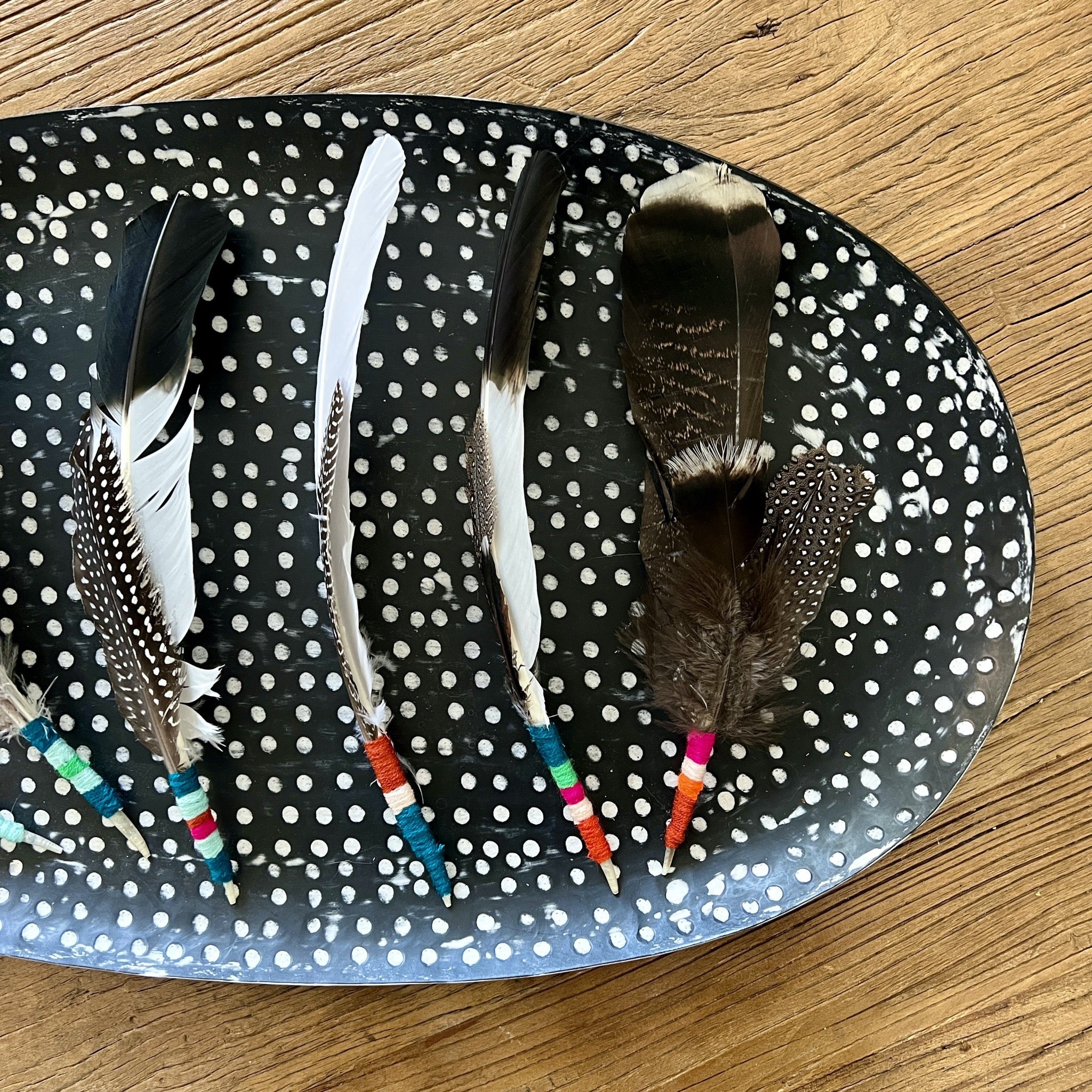 Smudging feather bundle with colorful hand-tied yarn handle. These natural ritual tools are created with intentions of peace, healing Reiki energy, and love for the best intentions to come forward. Feathers and hand tied color wraps will vary, no two will ever be the same. Comes with basic smudging instructions.