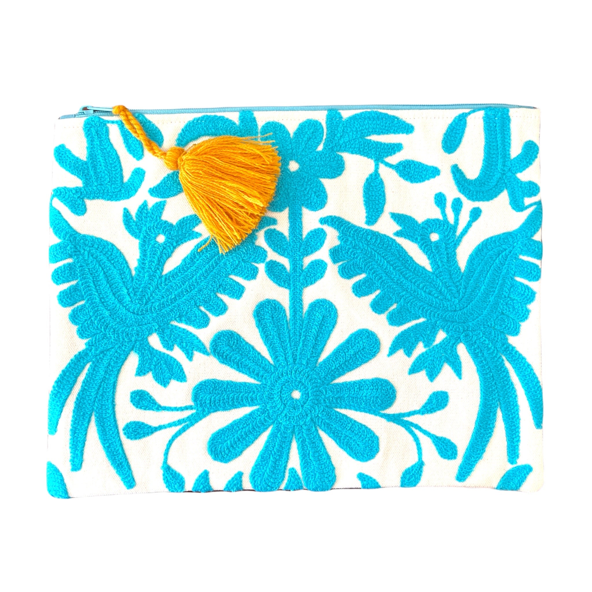 This embroidered Mexican Otomi pouch with colorful tassel will complete your outfit and your day.