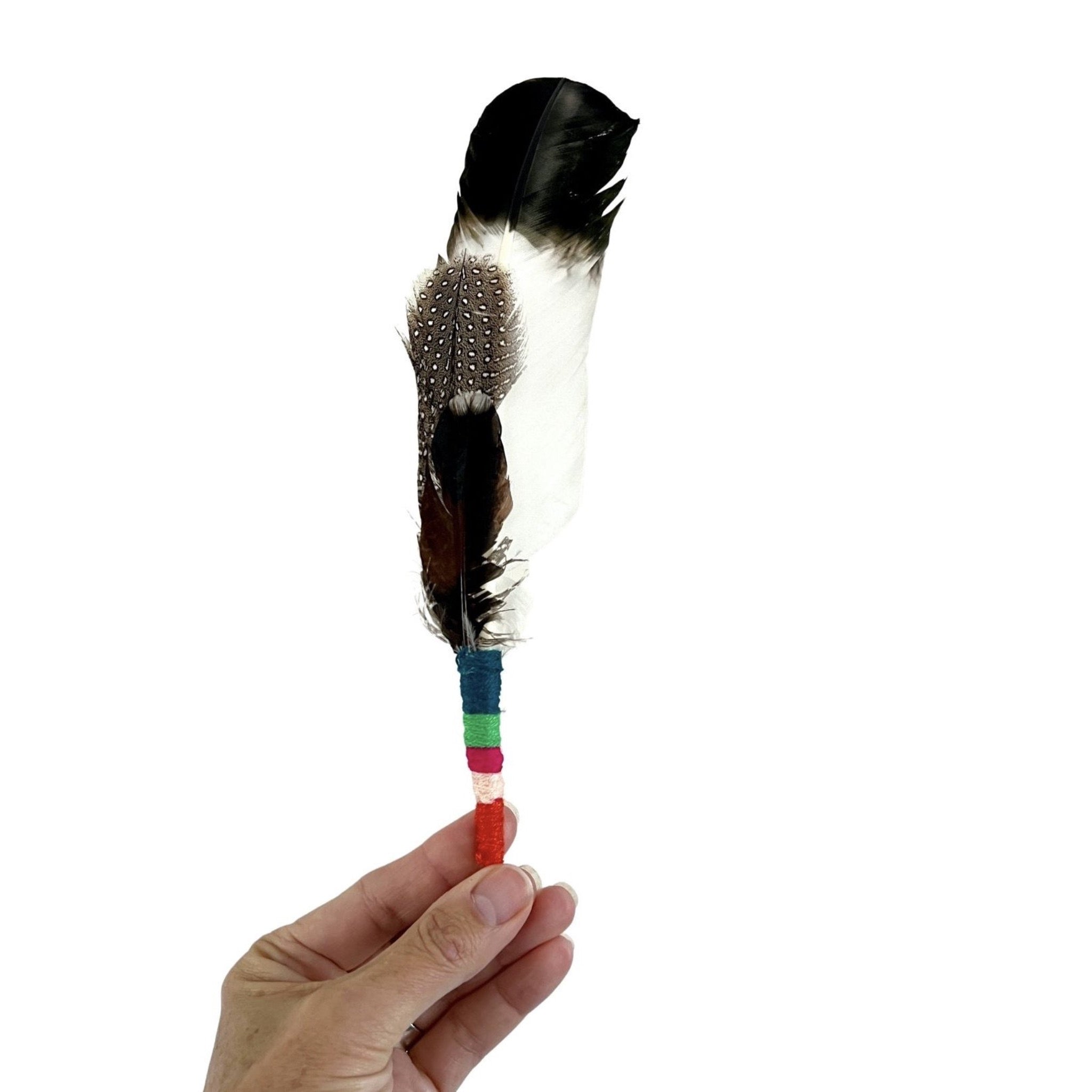 Smudging feather bundle with colorful hand-tied yarn handle. These natural ritual tools are created with intentions of peace, healing Reiki energy, and love for the best intentions to come forward. Feathers and hand tied color wraps will vary, no two will ever be the same. Comes with basic smudging instructions.
