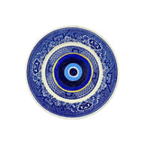 Antique vintage blue plates have been given new life with hand-painted evil eyes. Just the thing we need that we didn't even know we needed.