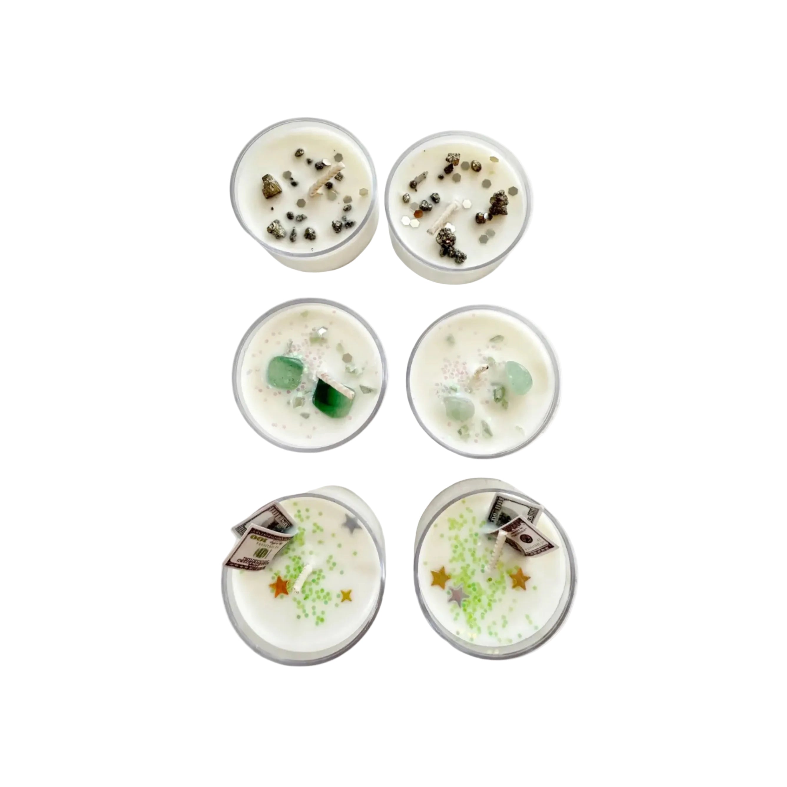 Six small tea light candles with decorative elements on a marble surface