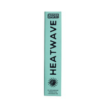 A tall, narrow mint-green box for Grass Earth Heatwave incense sticks, featuring bold black text and a sun graphic, set against a white background.