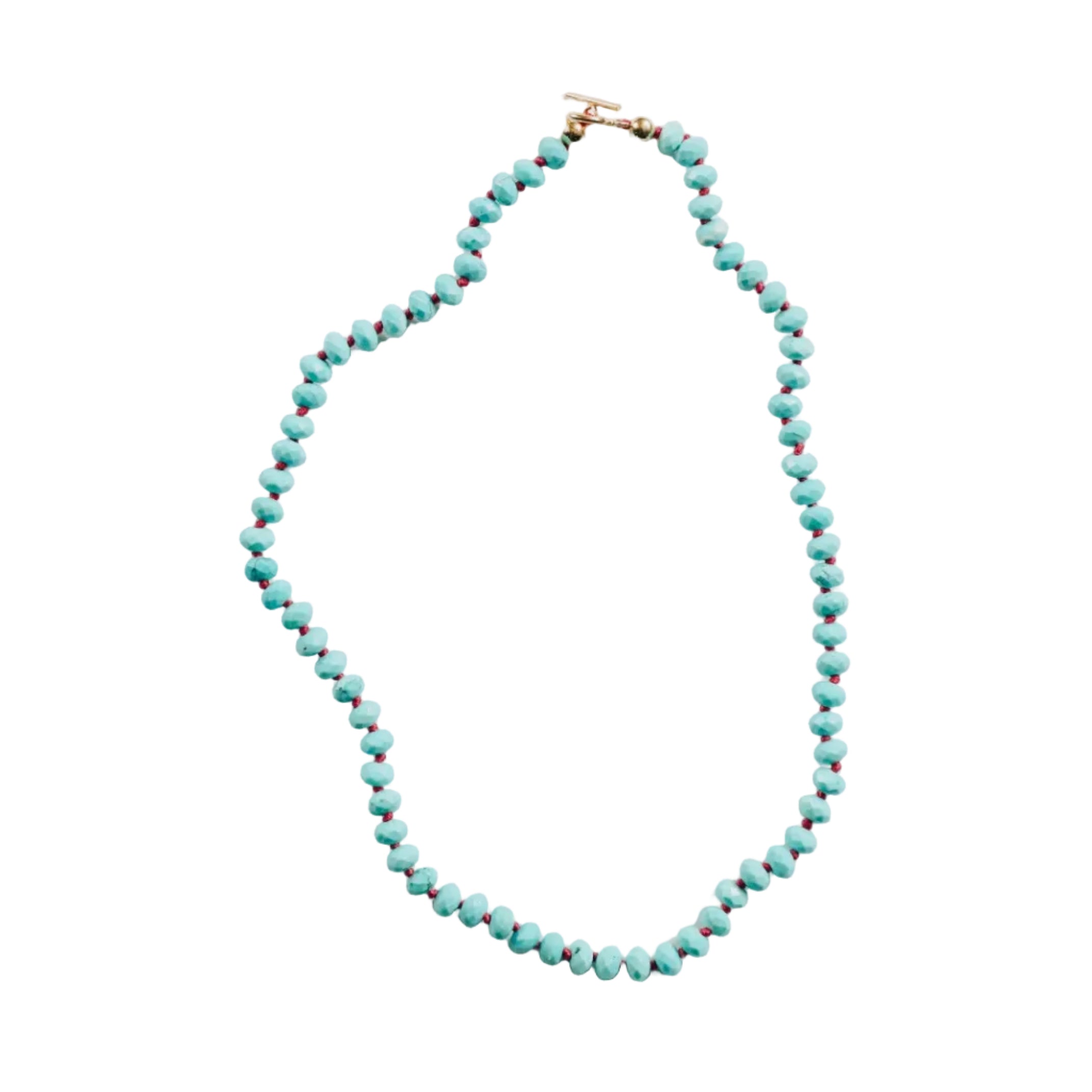 Turquoise beaded necklace on a light gray background