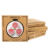 Red Holiday motif embroidery kit packaging with CozyBlue branding on a white background