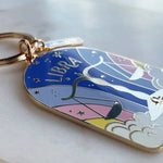 Keychain with Libra zodiac design on a light background