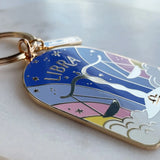 Keychain with Libra zodiac design on a light background