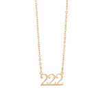 Gold necklace with '222' pendant on a white background