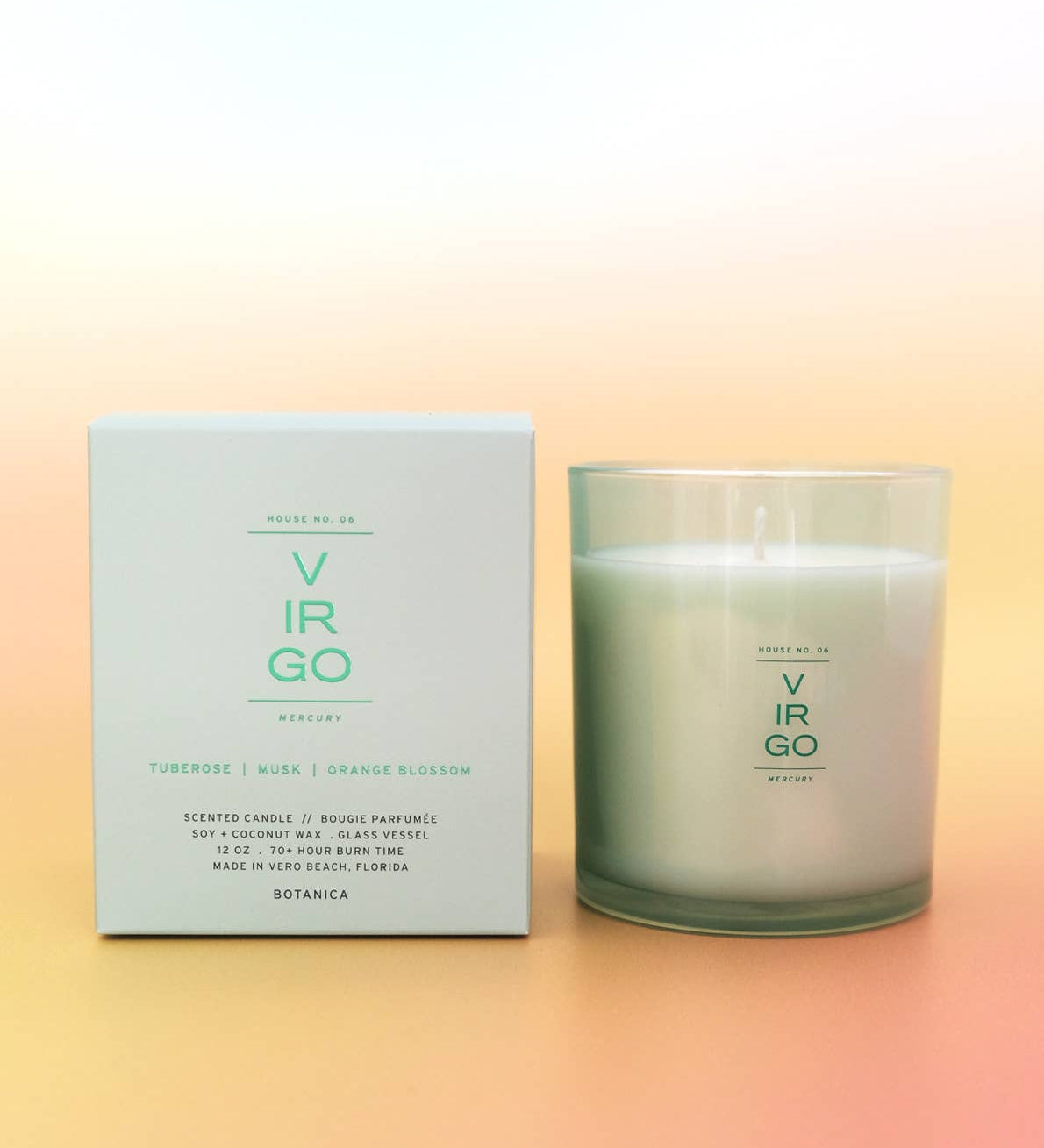 Candle and packaging with 'Virgo' branding on a gradient background
