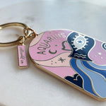 Keychain with Aquarius design on a light background