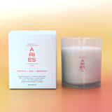 Aries candle and packaging on a gradient background