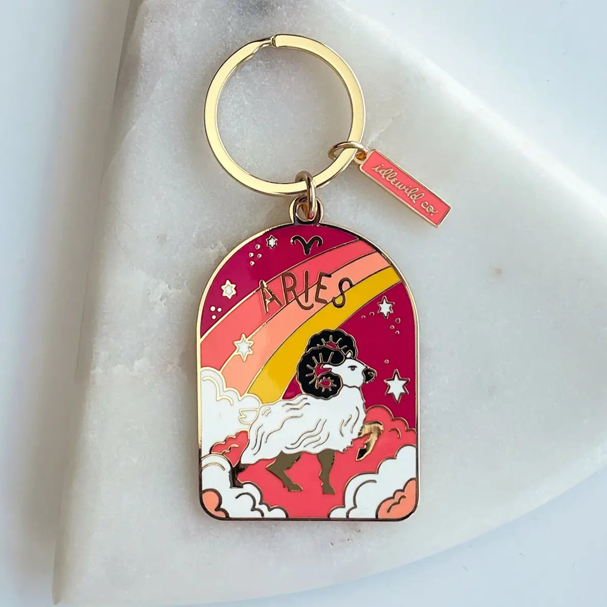 Keychain with Aries zodiac design on a white background