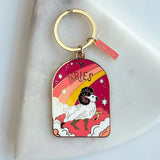 Keychain with Aries zodiac design on a white background