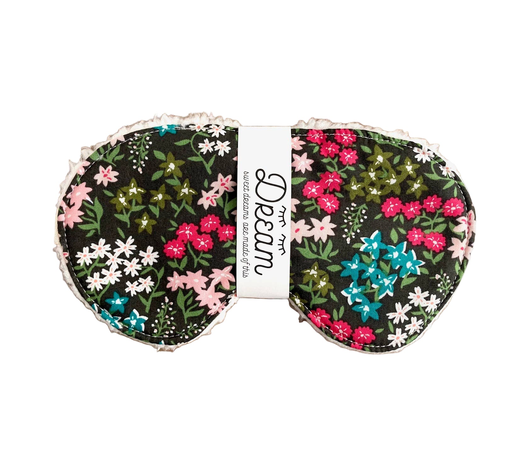 Floral eye masks on a wooden board with Dream label