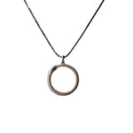 Necklace with a circular snake pendant on a white background