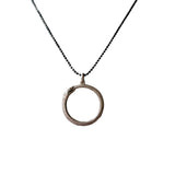 Necklace with a circular snake pendant on a white background