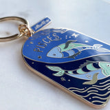 Keychain with Pisces zodiac design on a white background