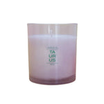 Candle in a glass jar with 'Taurus' text on a white background