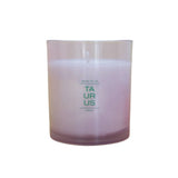 Candle in a glass jar with 'Taurus' text on a white background
