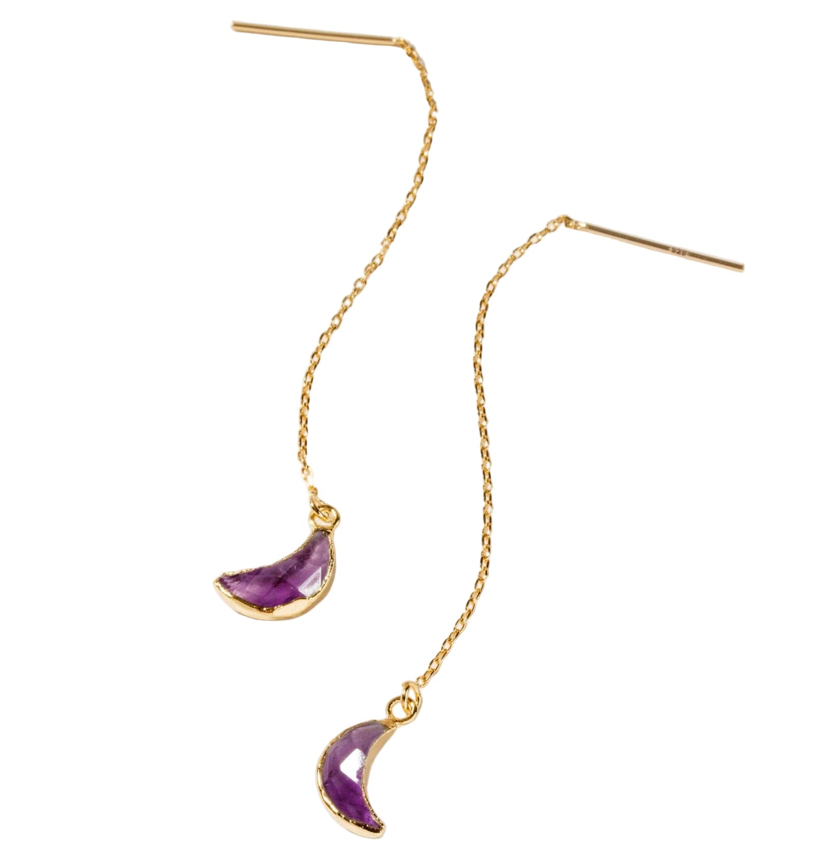 Gold earrings with purple crescent moon charms on a white background