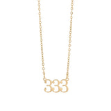 Gold necklace with '333' pendant on a white background