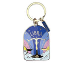 Keychain with Libra zodiac design on a white surface