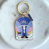 Keychain with Libra zodiac design on a marble surface