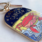 Keychain with Cancer zodiac sign design on a white background
