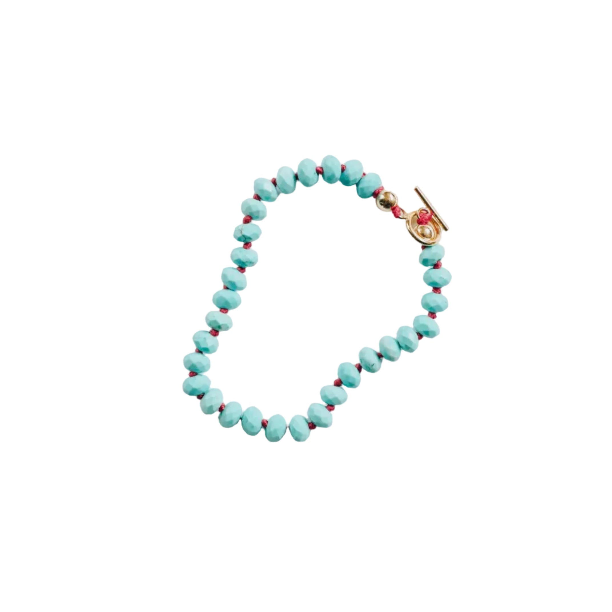 Turquoise beaded bracelet with a gold clasp on a white background