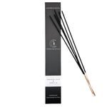 Black incense sticks with packaging labeled 'Smoked Oud & Vanilla' on a white background