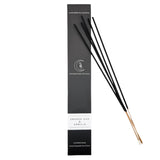 Black incense sticks with packaging labeled 'Smoked Oud & Vanilla' on a white background