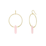 Gold hoop earrings with pink hanging elements on a white background