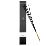 Black incense sticks with packaging on a white background