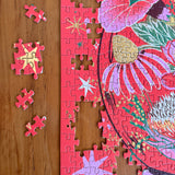 Floral puzzle with missing pieces on a wooden surface