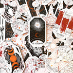 Collection of tarot card illustrations with various designs and text.