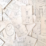 Collection of tarot cards with various illustrations on a light background