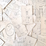 Collection of tarot cards with various illustrations on a light background