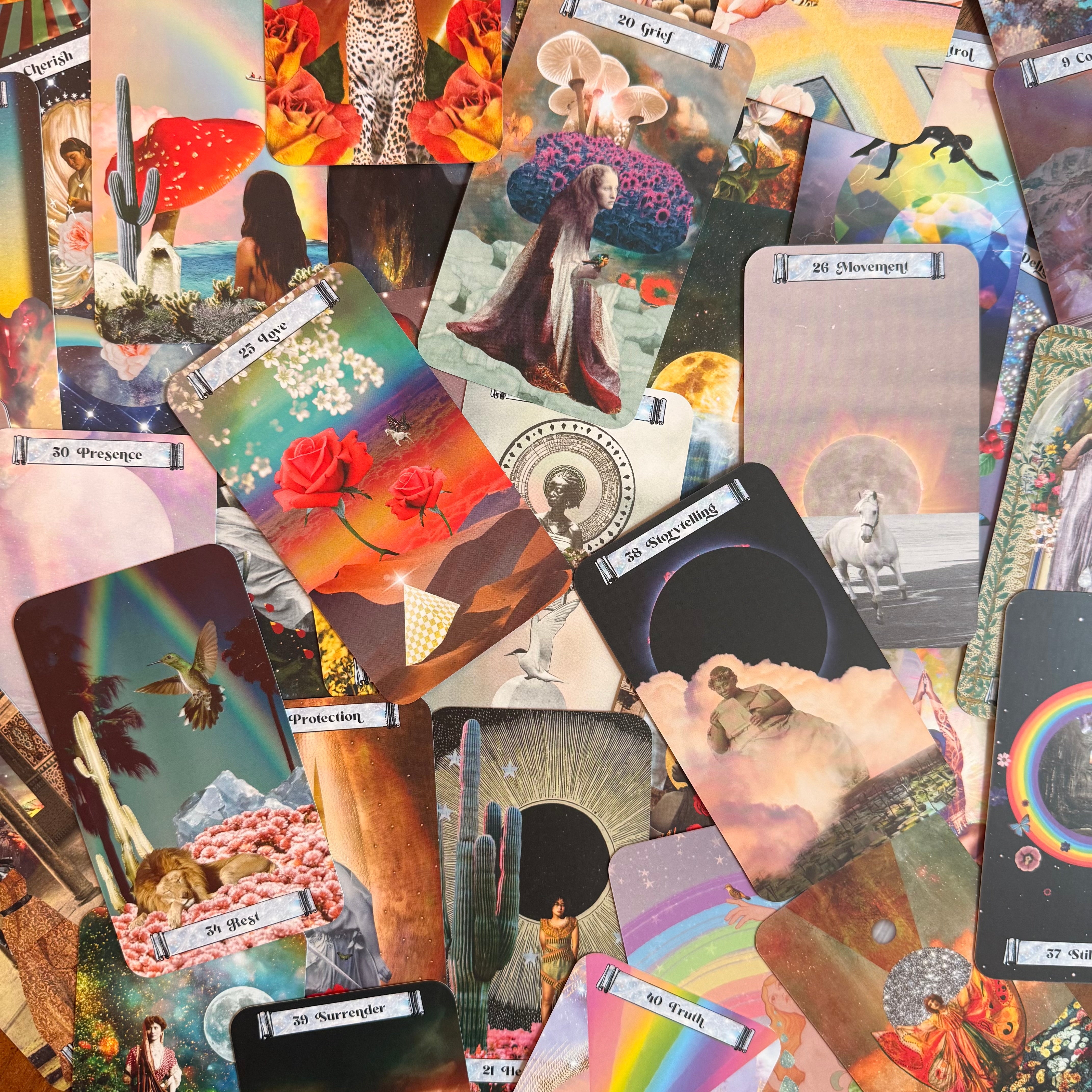 A scattered arrangement of illustrated oracle or tarot-style cards with colorful surreal artwork, including rainbows, flowers, figures, and abstract scenes. No person, animal, or real environment is present, so this is Product/Packaging rather than Lifestyle.