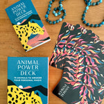 Animal Power Deck with cards and packaging on a wooden surface