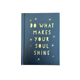 Black book with gold text 'Do what makes your soul shine' on a white background