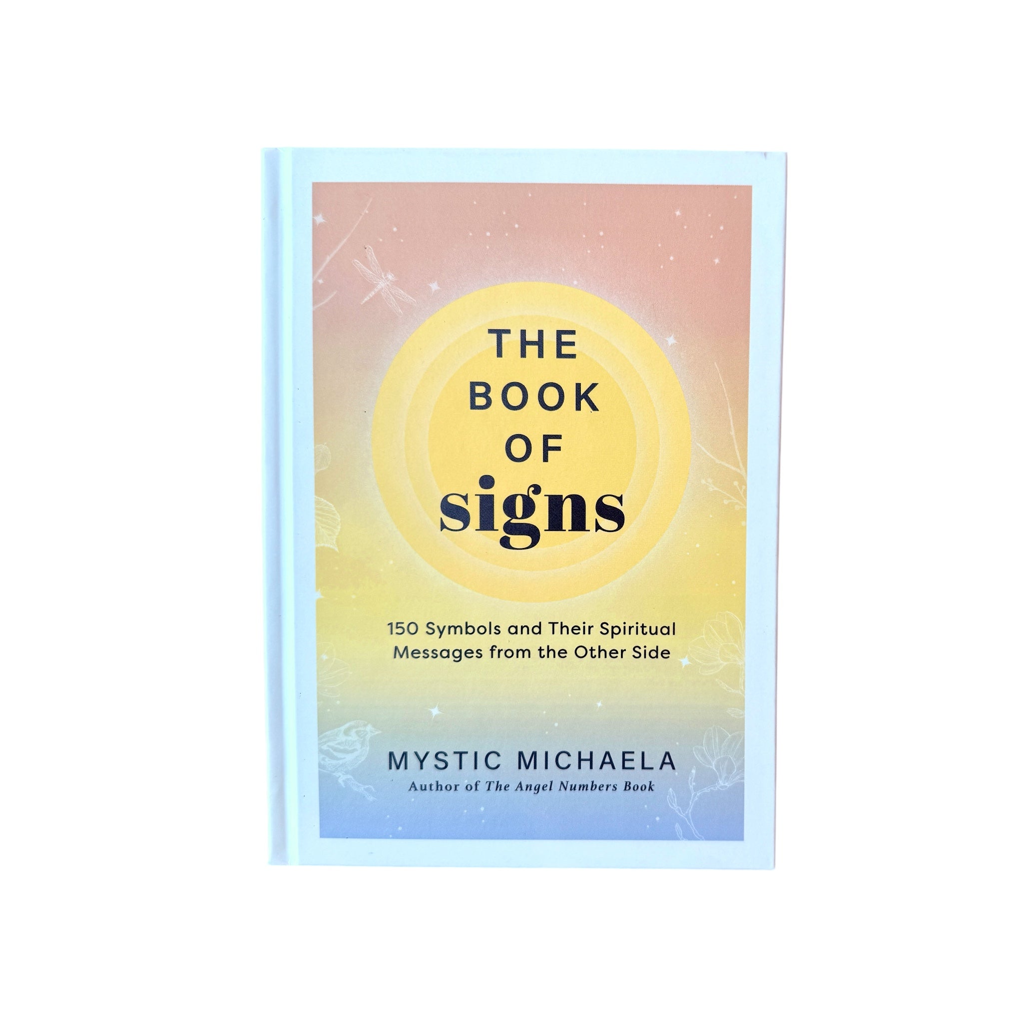 Book with The Book of Signs on the Cover on a white surface