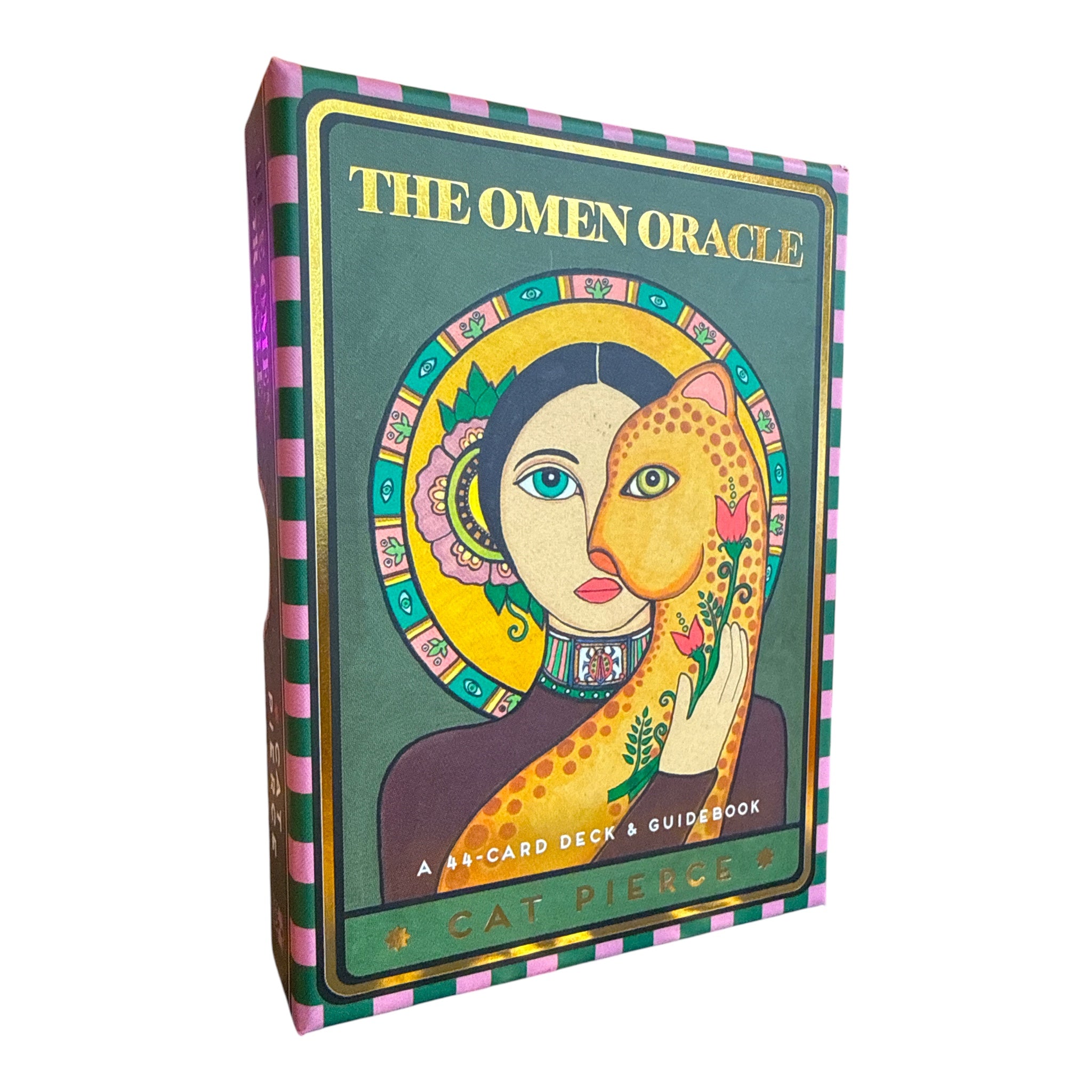 The Omen Oracle deck box by Cat Pierce, featuring a dark green cover with gold lettering and an illustration of a woman holding a leopard, with pink and green striped edges, shown on a white background.