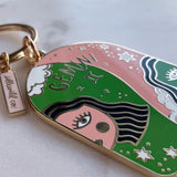Keychain with Gemini zodiac design on a white background