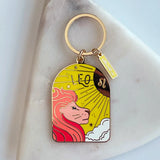 Keychain with Leo zodiac design on a marble surface