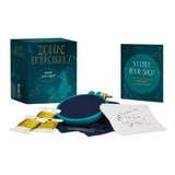 Zodiac embroidery kit with embroidery hoop, threads, and constellation chart on a white background