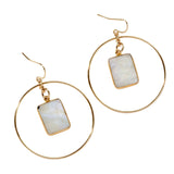 Gold hoop earrings with rectangular moonstone pendants in center, on a white background