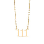 Gold necklace with the number '11' pendant on a white background