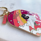 Keychain with Aries zodiac design on a white background