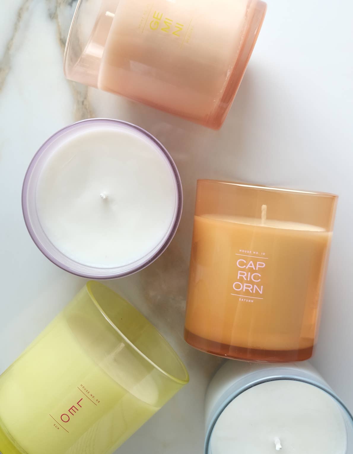 Collection of colorful candles on a light background