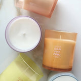 Collection of colorful candles on a light background