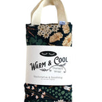 Floral-patterned therapy wrap with 'Warm & Cool' label on a white background